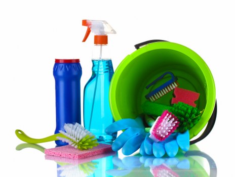 Professional cleaner working in an E16 apartment living room