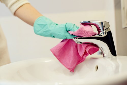 Office cleaning team servicing a workplace in E16