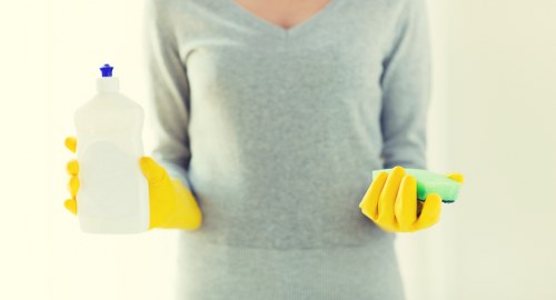 Professional upholstery cleaning in E16 for a fabric sofa in a modern apartment