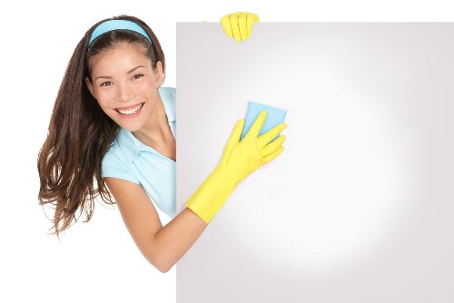 Deep cleaning a fabric sofa in an E16 apartment